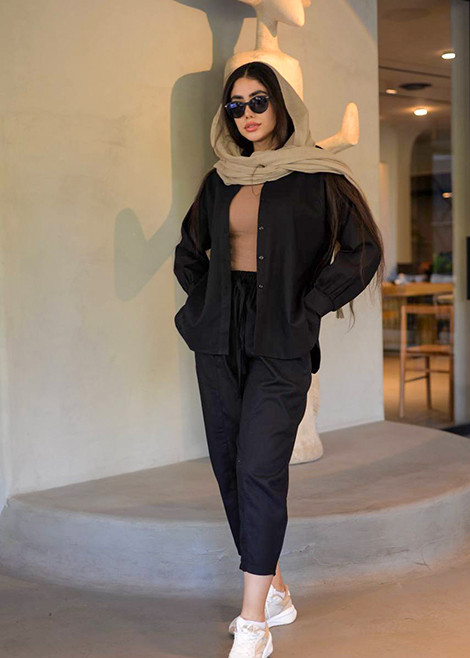 جزئیات دوخت و دکمههای شومیز مشکی ریچکت